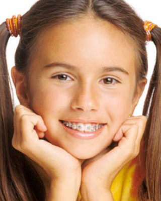 Young girl wearing metal braces